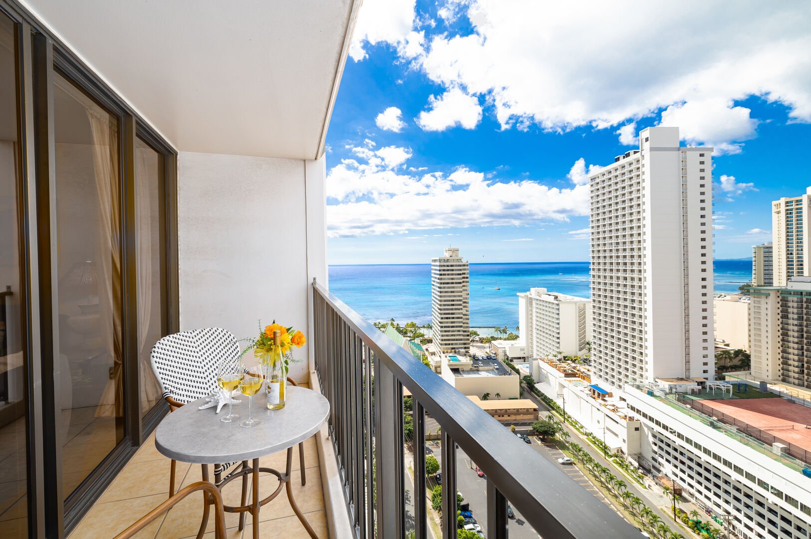 Enjoy the partial ocean view from the balcony and catch a glimpse of  beautiful sunsets