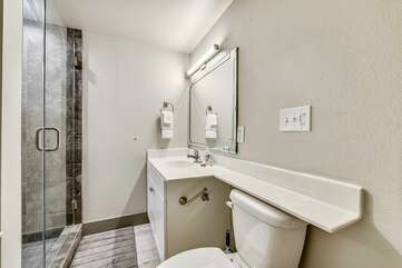 Second bathroom adjacent to King bedroom. Custom tiled shower!