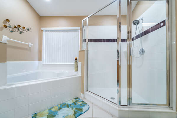 Master bedroom 2 en-suite showing shower and corner tub