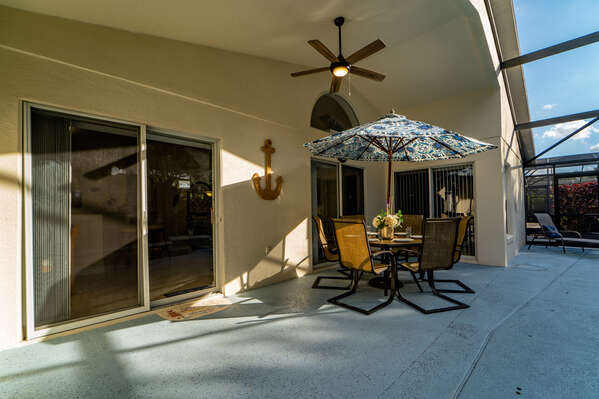 Shaded lanai area with patio table