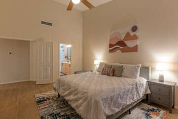 Enjoy sweet dreams in the cozy primary suite with a king bed, ceiling fan and en suite bath.