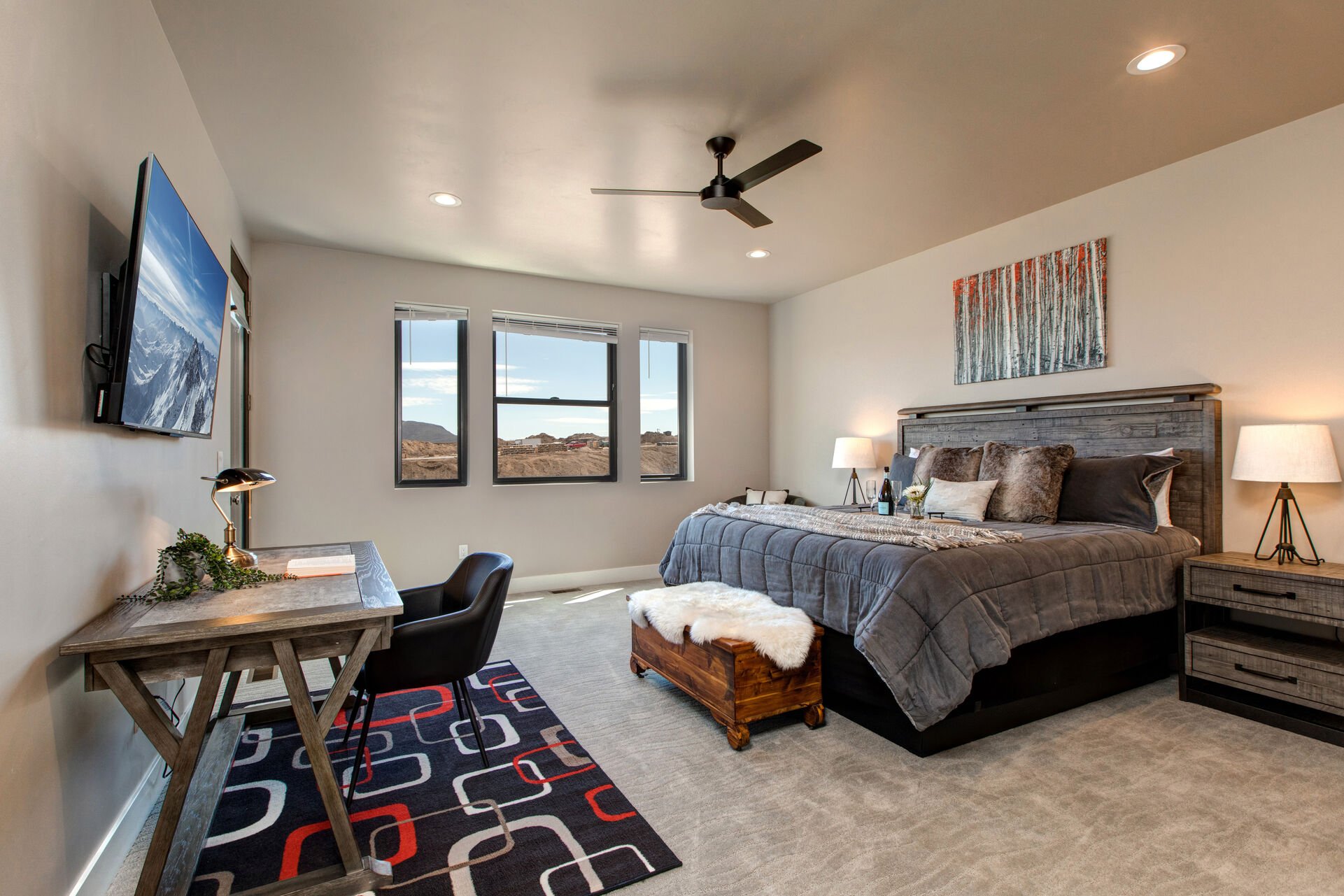 Main Level Grand Master Bedroom with a King Bed and Smart TV