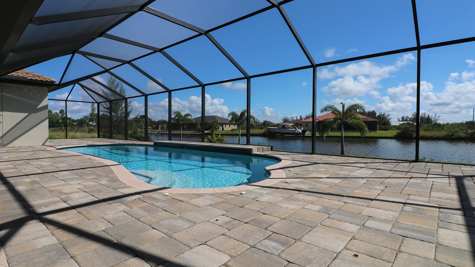 Spacious pool deck overlooking the canal