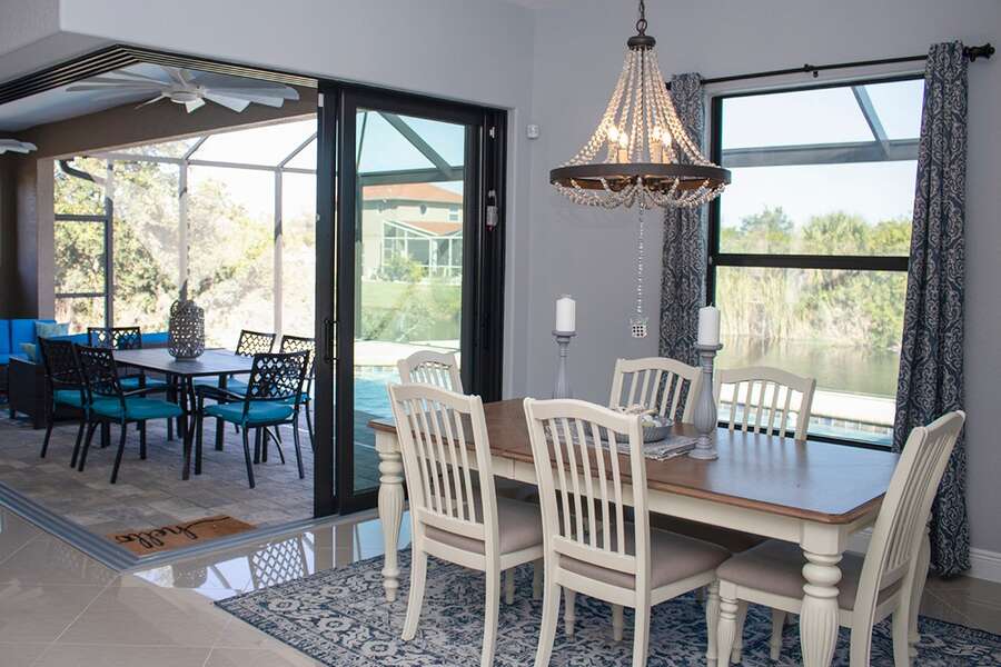 Dining space overlooking lanai and canal beyond
