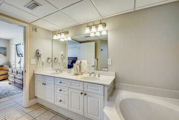 Master bathroom with double vanity, tub and stand up shower!