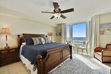 Master bedroom with beautiful view of the Gulf closet, mounted TV and private bathroom