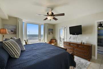 Master bedroom with beautiful view of the Gulf closet, mounted TV and private bathroom