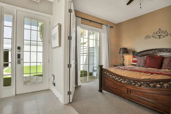 On the ground floor, there is a master suite with a king-sized bed and courtyard access.