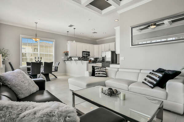 This modern living area has been designed with sophisticated black and white furnishings.