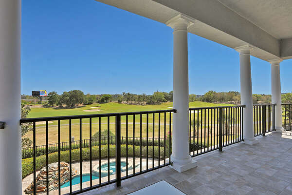 This room features a large balcony overlooking the pool and golf course.