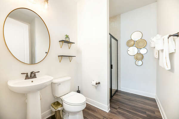 En suite bathroom with walk-in shower. For convenience, this bathroom also has a door to the common area.
