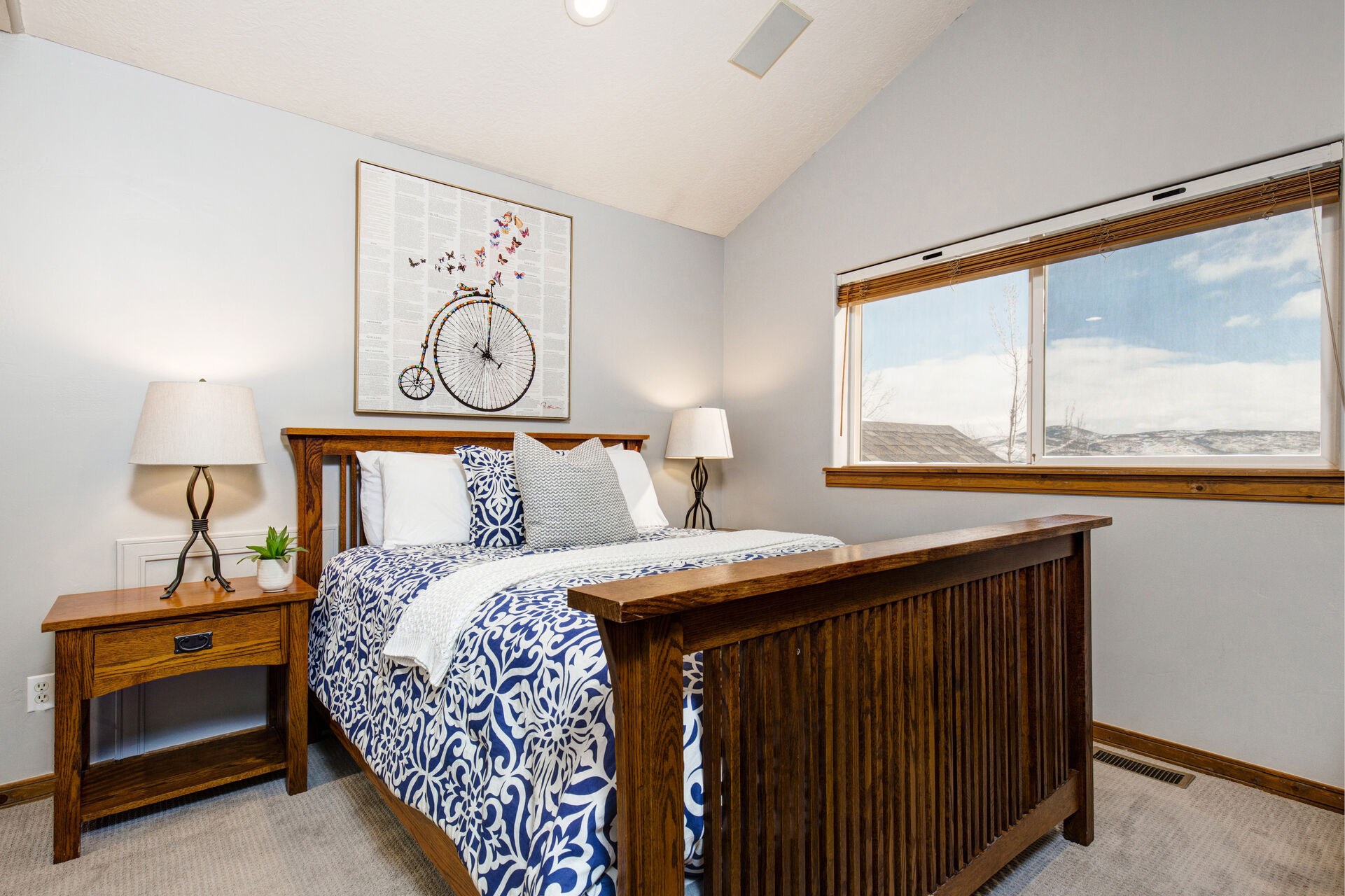 Upper Level Bedroom 2 with queen bed, Samsung smart tv, walk-in closet and full bath access