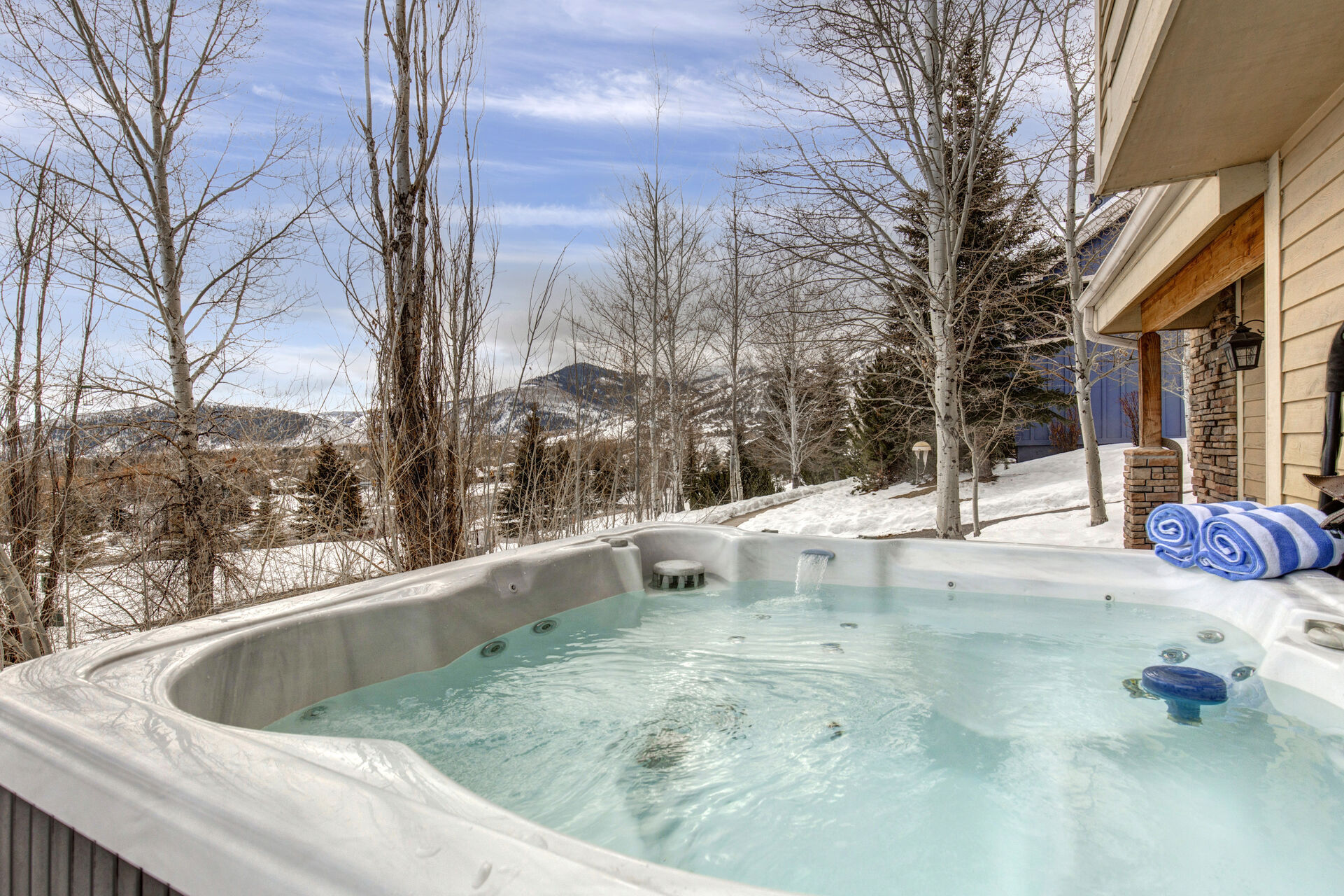 Lower Level Private Hot Tub patio with beautiful surrounding views of the mountains