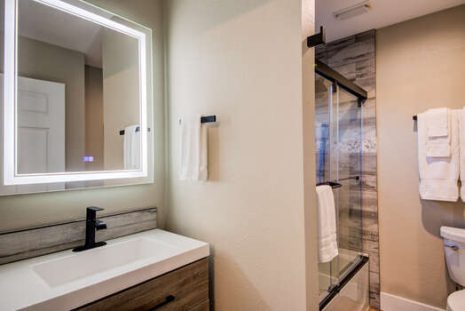 Renovated third full bathroom attached to third bedroom suite