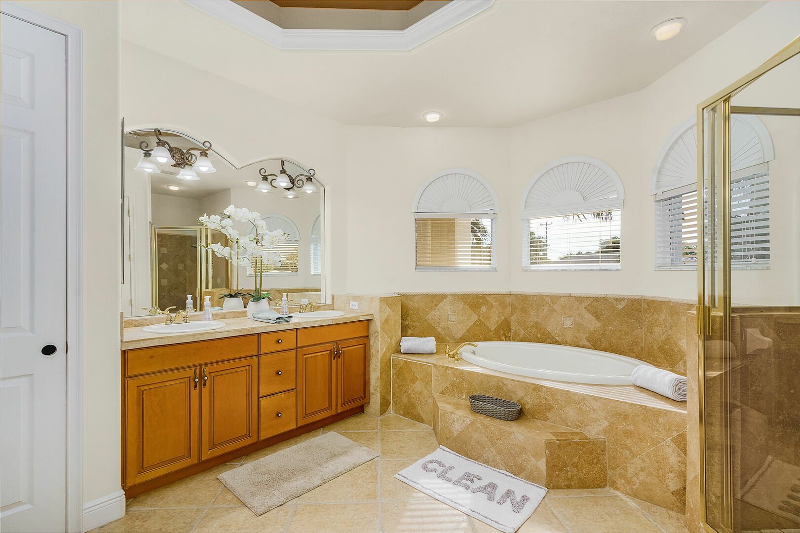 master bathroom with walk in shower and tub