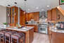 Chef's Kitchen with Stainless Appliances, Including a Wolf 6-Burner Gas Range