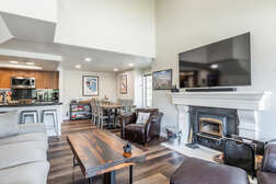Living Room / Wood Burning Fireplace / Flat Screen TV / Dining Table / Kitchen Bar with 4 Stools