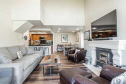 Living Room / Wood Burning Fireplace / Flat Screen TV / Dining Table / Kitchen Bar with 4 Stools