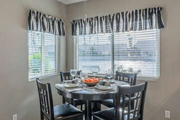 Wine and dine in dining area with appealing lake views.