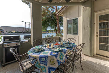 Covered patio with lake view offers an exciting dining option.
