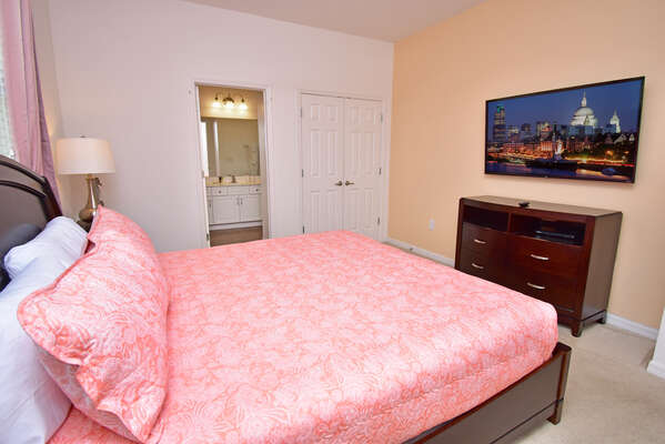 Master bedroom has a king bed, wall mounted flatscreen and en-suite bathroom