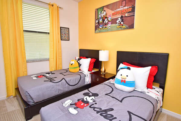 Bedroom 4 has a famous mouse theme, twin beds and wall mounted flatscreen TV