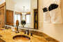 Master Bathroom with double copper sinks, jetted tub, and separate tile and glass shower
