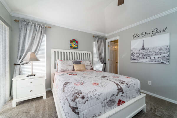 Master bedroom has a queen bed, walk in closet, en-suite bathroom and patio doors to pool area