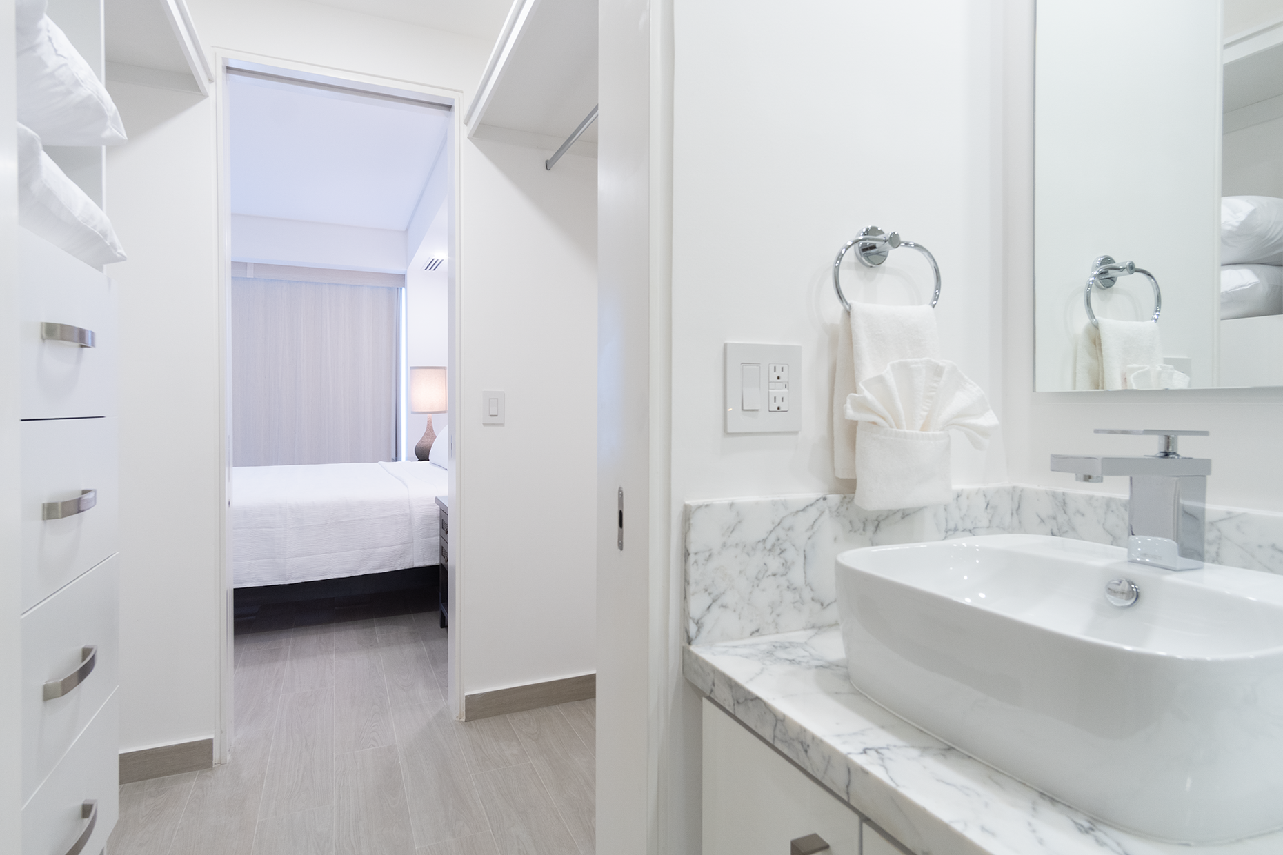 The bedroom in this unit is a suite with an attached bathroom and walk-in closet.