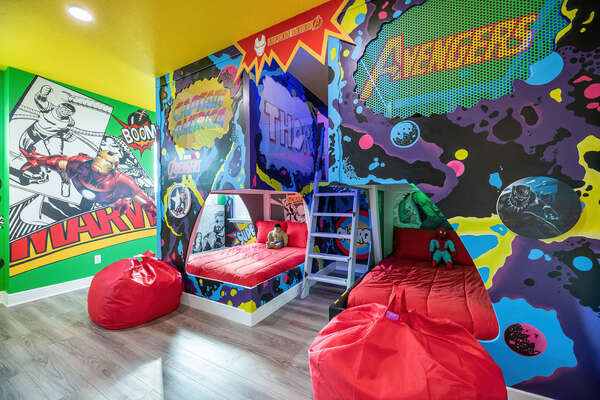 This superhero-themed bedroom features 2x double/double bunk beds