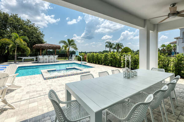 Dine al fresco at the outdoor dining table with seating for 10 on the lanai