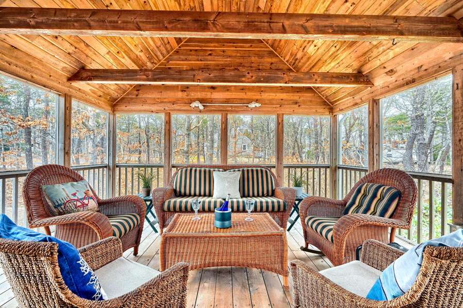 Screened Porch with plenty of seating to recap the day's adventures - 75 Candlewood Drive-Eastham-Cape Cod -