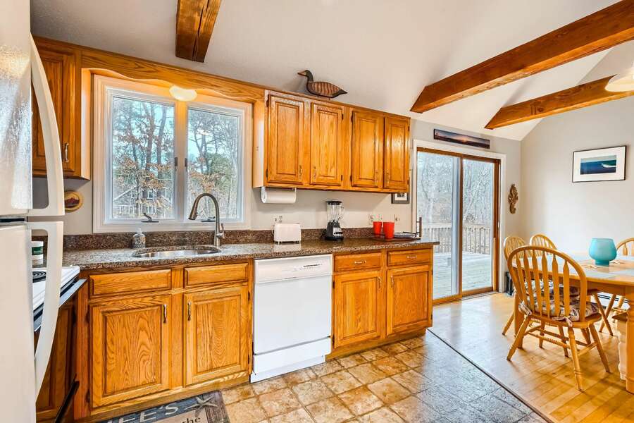 Kitchen and dining area with slider to deck-75 Candlewood Drive-Eastham-Cape Cod -