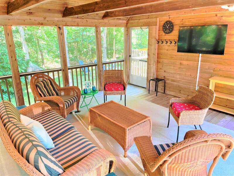 Screened porch with flat screen TV where you can spend evenings enjoying the breeze - 75 Candlewood Drive-Eastham-Cape Cod -