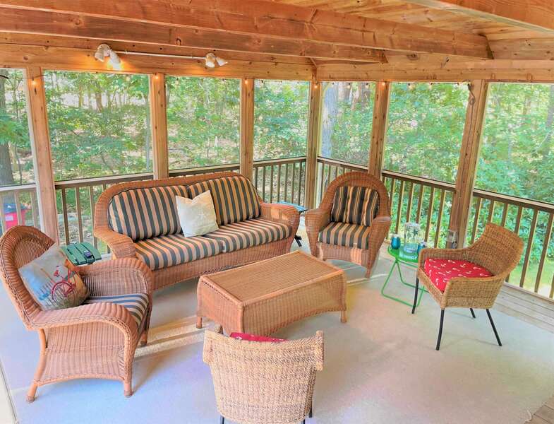 Screened in porch has access to driveway, kitchen and deck at 75 Candlewood Drive-Eastham-Cape Cod -