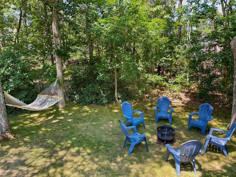 Spend some time in the hammock or seated in an Adirondack chairs by the fire pit  - 75 Candlewood Drive-Eastham-Cape Cod