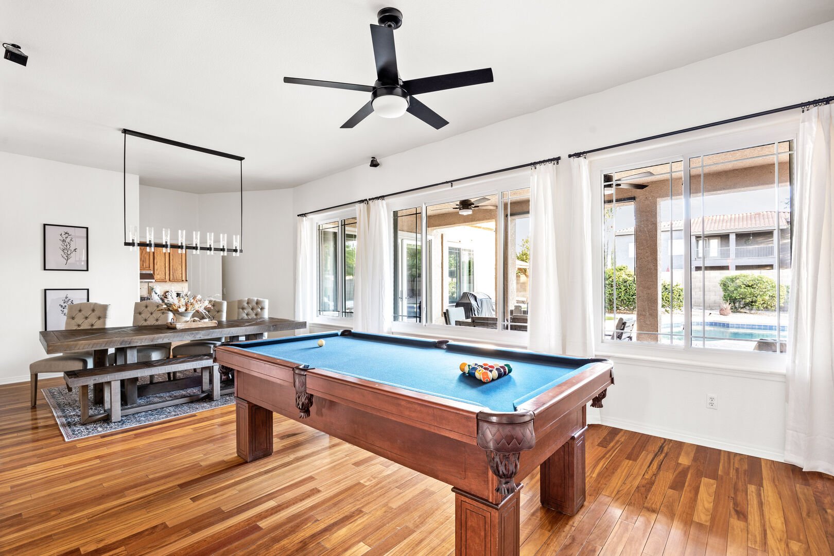 Pool Table w/ Dining Area in Background
