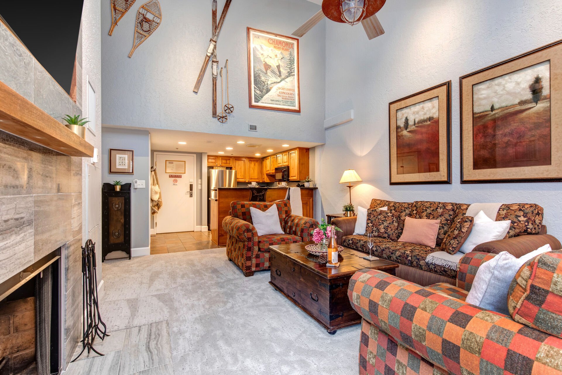 Main Living Room with plush furnishings, sofa-sleeper, wood burning fireplace, and 65