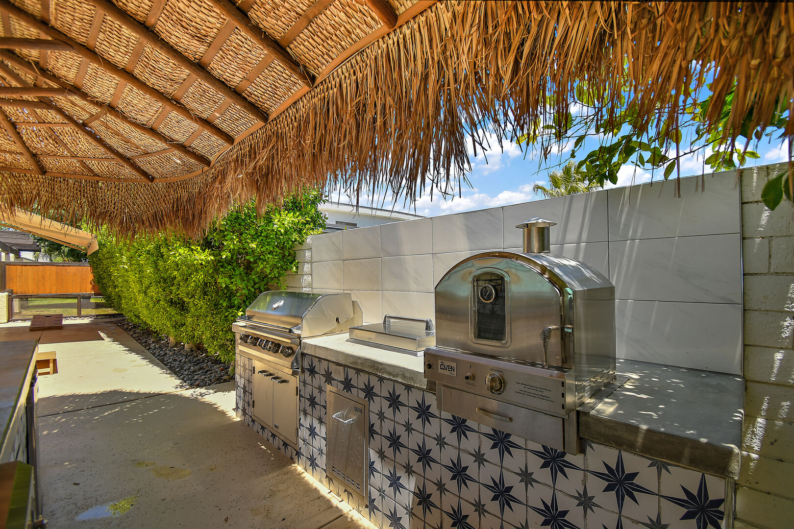 This awesome space is kept shaded under a Palapa covering with a switch controlled fan.