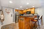 Fully Equipped Kitchen with stone countertops, GE appliances, and bar seating for two