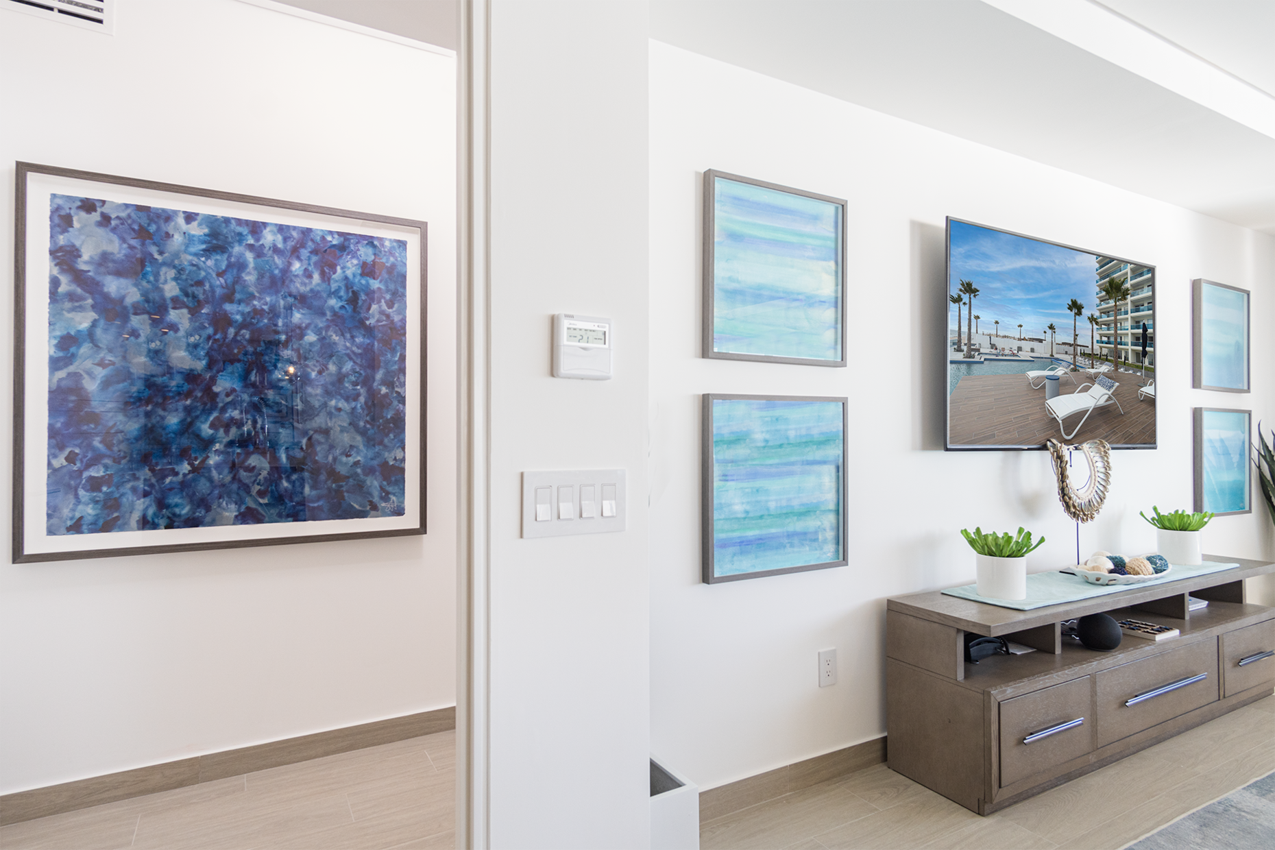 THis condominium is set apart by its custom art work throughout.