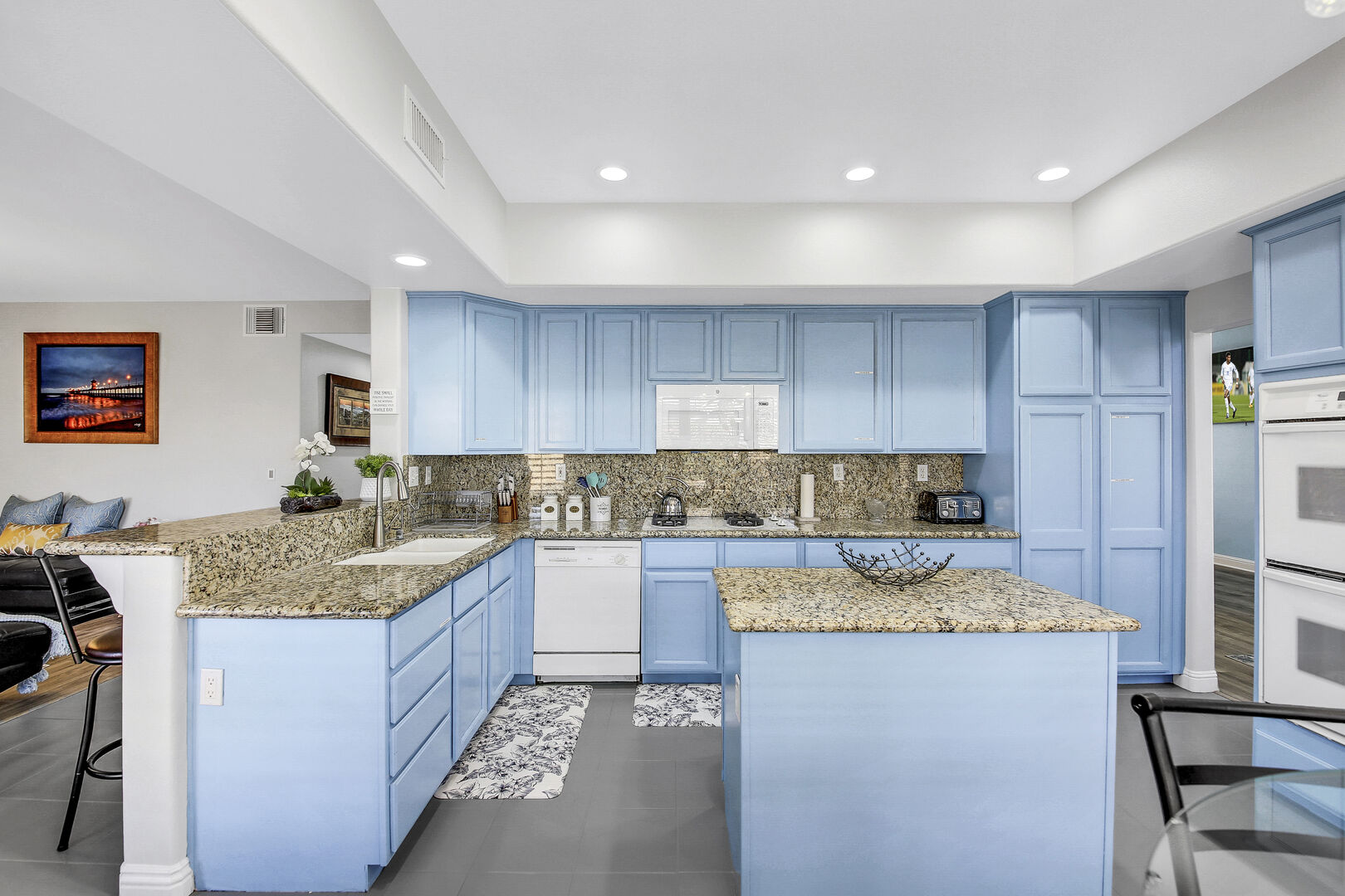 This family kitchen offers everything one would need to create their perfect meal including granite countertops.