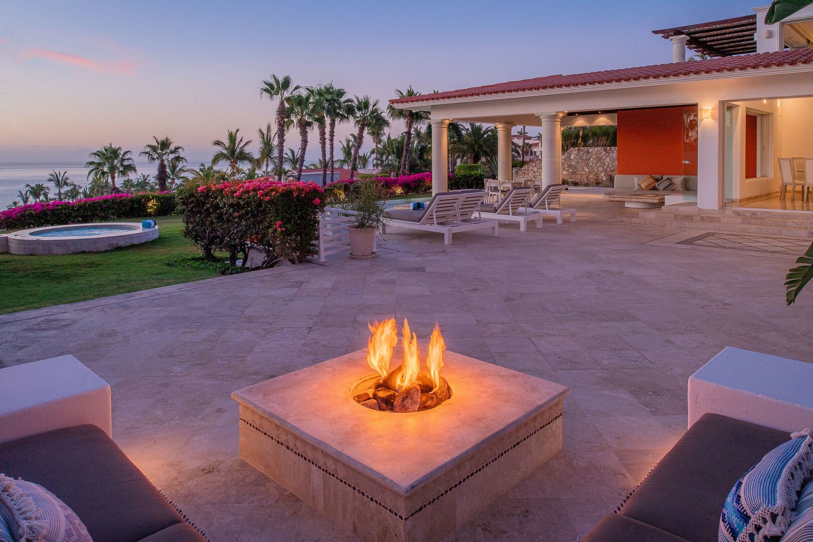An outdoor seating area with a small firepit.