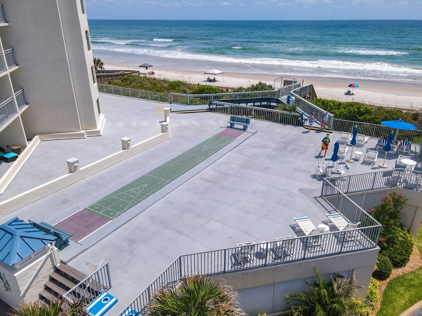 Sun deck, outdoor shuffleboard courts and cornhole game area all can be enjoyed while taking in the oceanfront views!  All steps from the Seascape Towers ground level patio!
