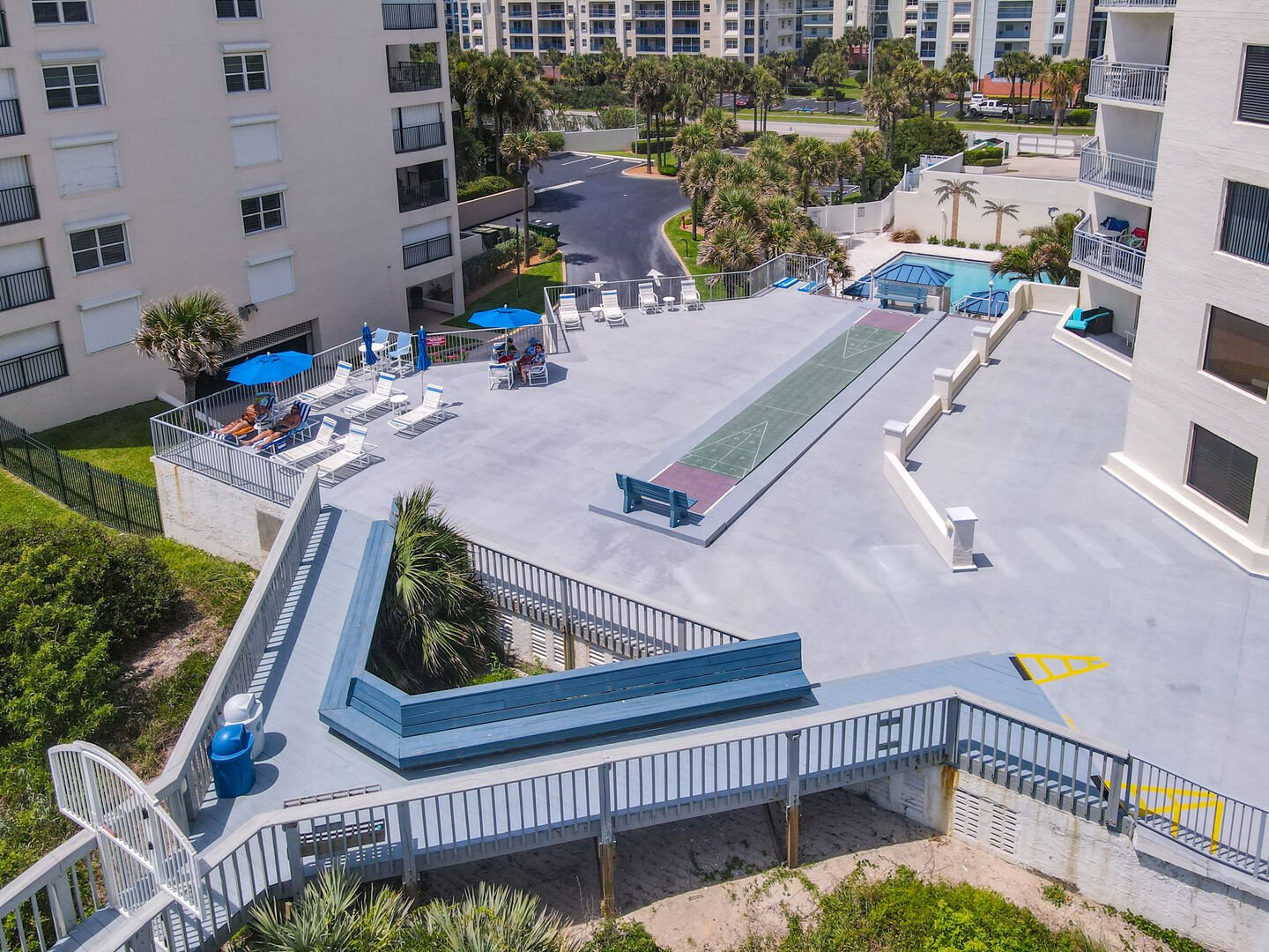 Sun deck an outside shuffleboard courts with access to the beach just outside the ground level patio doors!