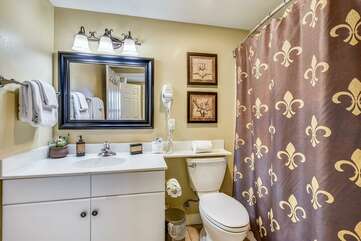 Hallway bathroom with shower/tub combo and washer and dryer,