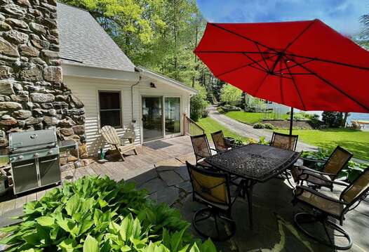 Access to the patio with seating, sun umbrella, propane Weber grill, firepit, seating, etc!