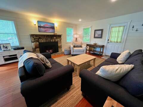 living room with propane fireplace, Samsung Portrait Smart HDTV, Crosby record player, games, etc!