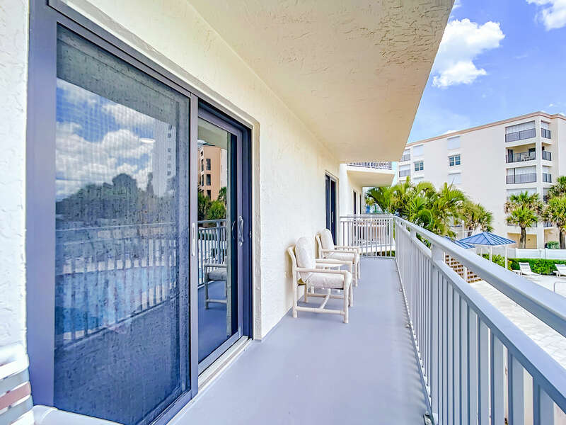 Shared balcony between the master suite and the 2nd bedroom.  Overlooking the pool area.