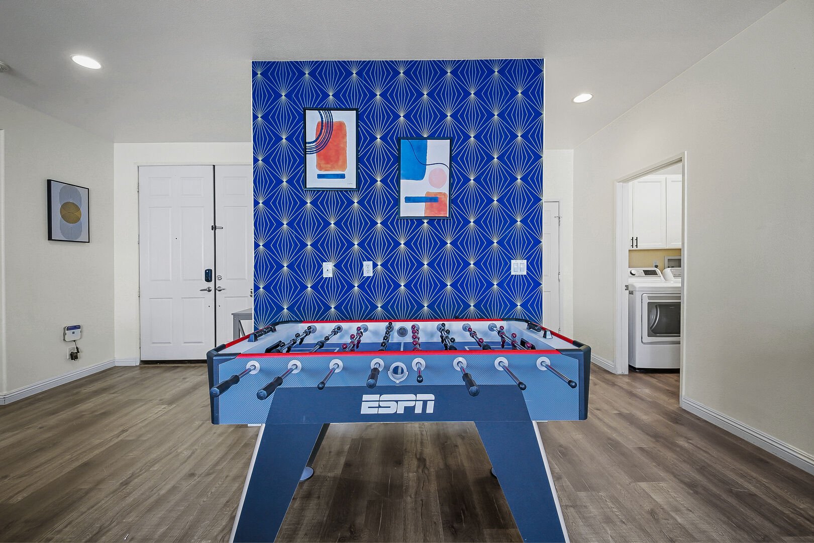 The home features an ESPN Foosball table.